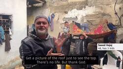 Displaced family in Gaza bakes bread in the rain News Clip