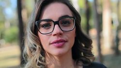 Feminist Girl wearing glasses looking directly to camera Stock Footage