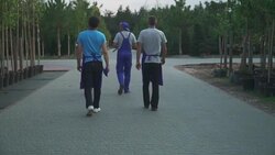 Gardeners are walking in the garden Stock Footage