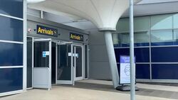 Passengers walking from East Midlands Airport News Clip