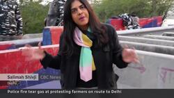 Police fire tear gas at protesting farmers heading to Indian capital News Clip