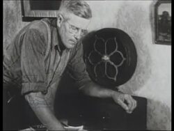 Orson Welles radio broadcast of ‘War of the Worlds’ on October 30th 1938, archive footage of radio listeners looking worried Stock Footage