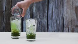 Making green tea soda from concentrated green tea syrup and soda water Stock Footage