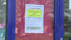 West London pharmacy with coronavirus notices in window News Clip