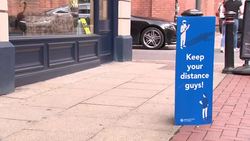 Manchester streets with Covid19 social distance safety signs News Clip