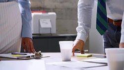 Mid section of male and female business people at a meeting Stock Footage