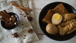 hard-boiled egg in brown sauce or sweet gravy sauce Stock Footage