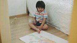 Boy is drawing and crayon of dinosaur Stock Footage