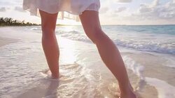 Legs of young Caucasian female outdoor going barefoot Stock Footage