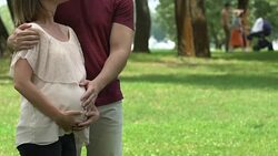 Happy pregnant couple embracing, successful vitro fertilization, family planning Stock Footage