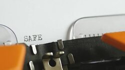 Close up footage of a person writing SAFETY on an old typewriter, with sound Stock Footage