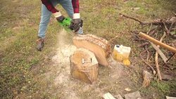 Lumberjack cutting woods with a chainsaw for winter. Stock Footage