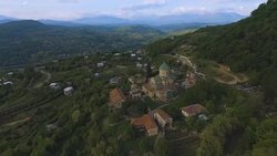 Caucasus green hills with famous ancient Bagrati Cathedral, Kutaisi sightseeing Stock Footage