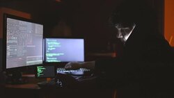 Hacker talking on the phone Stock Footage