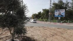 CLEAN : Cars drive past campaign billboards for Israel's Likud party in Bedouin town News Clip