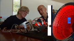 Watch: Parkinson's sufferers claim infrared light helmets ease symptoms News Clip