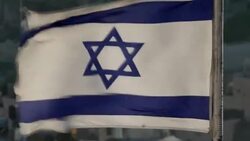 Sequence showing a flag with the Star of David and a wide view of the city of Jerusalem Stock Footage