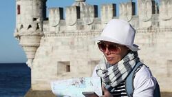 Portrait of tourist girl studying a map Stock Footage