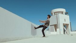 Parkour athlete running up urban wall doing extreme backflip outside isolated in sky Stock Footage