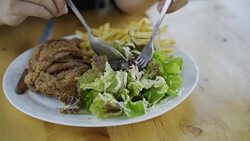 slow-motion of woman eating salad Stock Footage