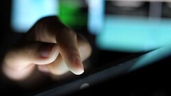 Close-up using tablet at night Stock Footage