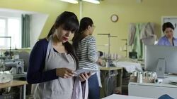Woman Using Computer at Sewing Factory Stock Footage