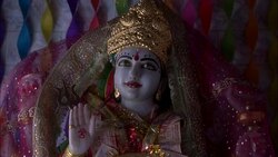 MEDIUM ANGLE OF FACE OF STATUE OF HINDU GOD. RELIGIOUS. Stock Footage