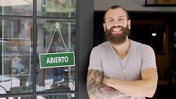 Young man running a Spanish small business Stock Footage