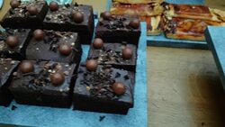 Woman serving cakes on table of delicious array of desserts 4K Stock Footage