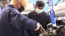 Boris Johnson helps repair engine on automotive shop visit News Clip