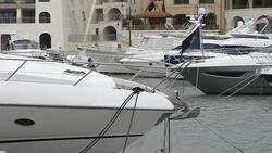 Super yachts moored at Portomaso Marina in St Julian, Malta Stock Footage