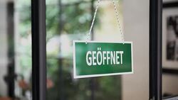 Young man opening a German shop Stock Footage