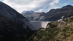 Flight over Kolnbrein Dam and Kolnbreinspeicher lake in Carinthia, Austria. Stock Footage