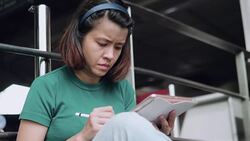 Designer drawing a sketch on tablet using stylus at city Stock Footage