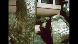 UNITED STATES 1960s: Pan of sculpture in courtyard. Stock Footage