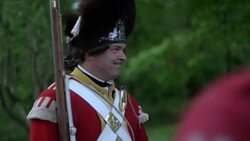 British Grenadier soldier wearing bearskin hat holding musket Stock Footage