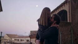 Happy couple on vacations. Old town panorama in background Stock Footage