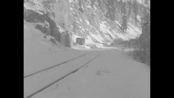 Bus converted to locomotive with snowplow moves passengers down track News Clip