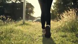 close up foot slow motion running on grass ground Stock Footage