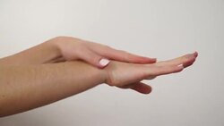 Woman taking care of her dry hands applying cream. 4K Stock Footage