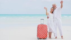 Portrait of retired vacation couple on tropical beach Stock Footage