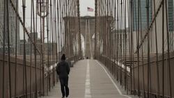 Person walks the Brooklyn Bridge in the midst of the coronavirus outbreak News Clip
