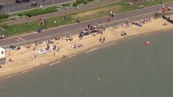 Aerials of a sunny Southend on Sea beach News Clip