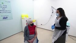 Woman having a Covid-19 vaccination jab News Clip