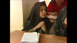 Girls in classroom at school in refugee camp News Clip
