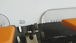 Close up footage of a person writing ESPIONAGE on an old typewriter, with sound Stock Footage