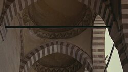 UP ANGLE OF STRIPED POINTED ARCHES AND CEILING. COULD BE SULEYMANIYE MOSQUE. ISLAMIC ARCHITECTURE. Stock Footage