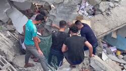 Survivors dig through ruins of church hit by Israeli air strike News Clip