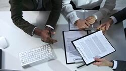 Business People Discussing Contract Agreement Stock Footage