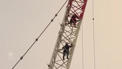Woman rescued from crane tower in dramatic operation News Clip